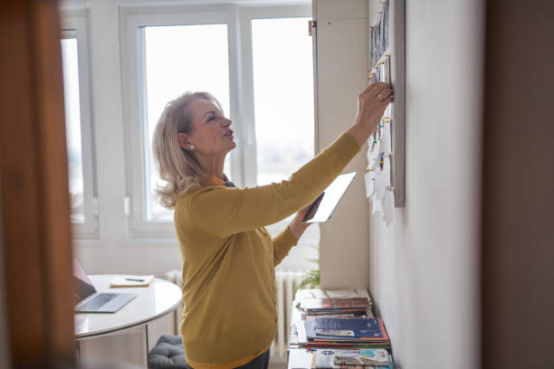 istock Senior woman planning home renovation 1947975103