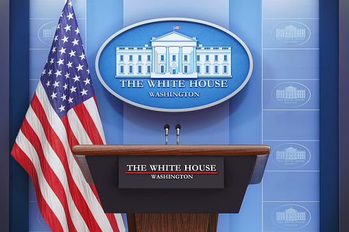 Briefing of president of US United States in White House. Podium speaker tribune with USA flags and sign of White House. Politics, president election concept. 3d illustration