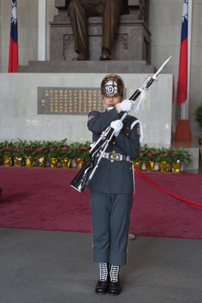 Honorary guard in uniform performing ceremonial duties at a memorial hall