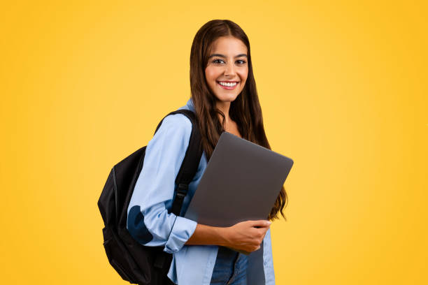 istock Glad confident european teenager student, pupil lady with backpack with computer 1948014348