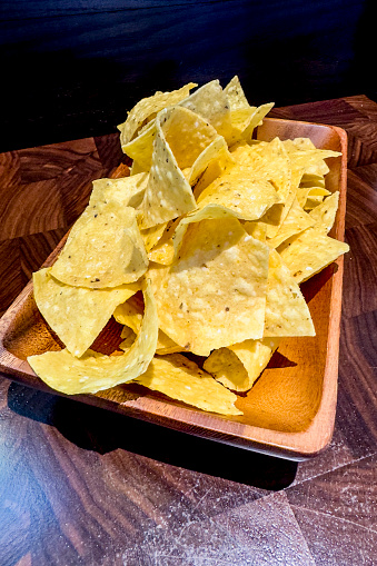 Full-frame close-up of a stack of chips. This image can be used as a background.