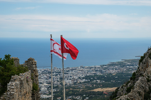 Turkish Republic of Northern Cyprus Flag with Turkish Flag on Castle.