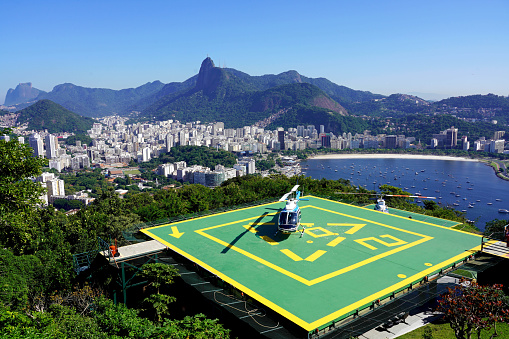 RIO DE JANEIRO, BRAZIL - JUNE 21, 2023: Helipad on Urca Hill with Rio de Janeiro cityscape and Corcovado mountain on the background, Rio de Janeiro, Brazil
