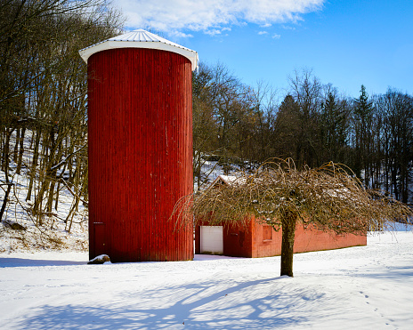 Tarrywile Park winter landscape with red silo and storage house in Danbury, Connecticut, USA