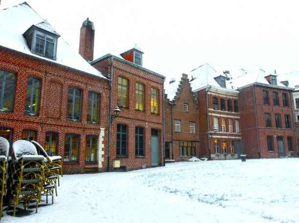 Old building in Flanders under the snow