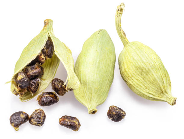istock Green cardamom pods and seeds isolated on white background. 1948093880