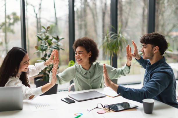 istock Diverse Young Business Team Shares High Five in Office Interior 1948113155
