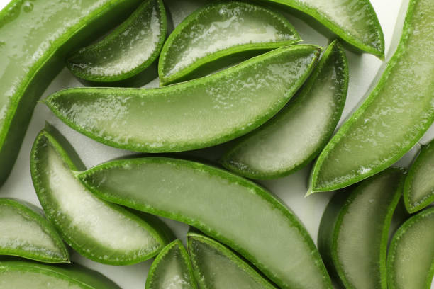 istock Fresh aloe vera pieces on white background, flat lay 1948125632