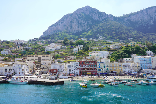 CAPRI, ITALY - MAY 2, 2022: Beautiful view from the sea of Marina Grande port of Capri Island, Italy