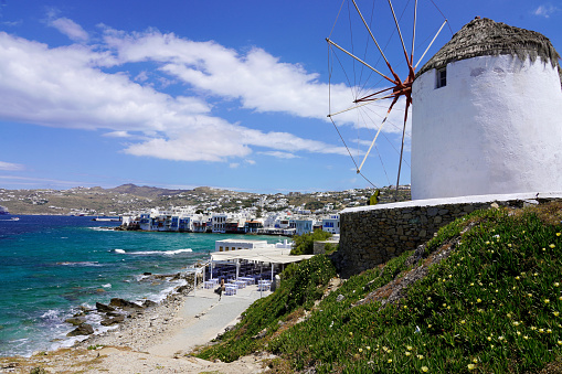 Beautiful view of Mykonos village with traditional windmill and sescape, Mykonos Island, Greece