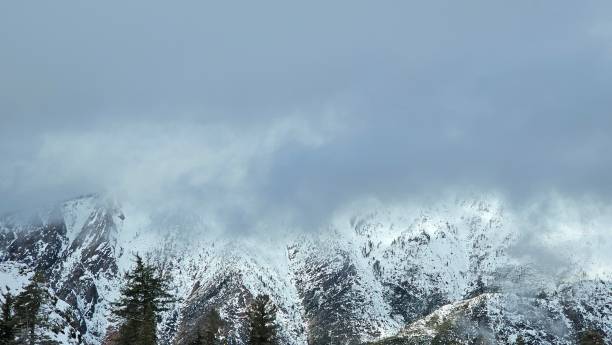 istock Snowing,  windy up to hills 1948184895