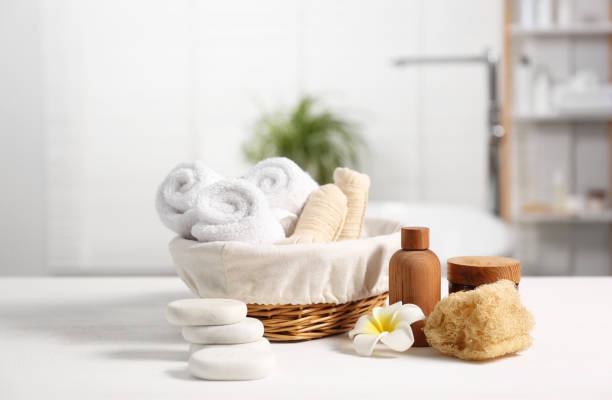 Composition with spa products on white wooden table in bathroom