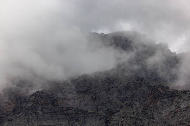 Beautiful landscape with stormy clouds and fog in Glacier NationalPark, Montana.