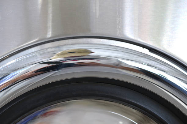 Washing Machine Drum Chrome Interior Close-up. High quality photo