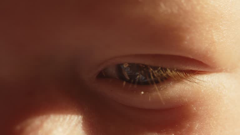 SLO MO Extreme Close-up Full Frame Shot of Sun Kissed Baby Boy's Eye