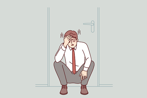 Frustrated businessman feels powerless when learns that company is approaching bankruptcy, sits sadly under door in office. Man manager made critical mistake and risks losing job and salary