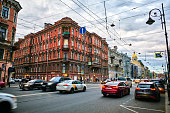 Cityscape of the street, old residential buildings and road with cars in the historical center of St. Petersburg