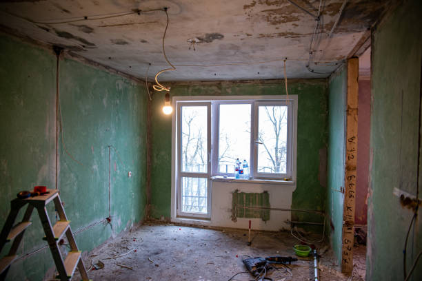 istock Abandoned building interior in disrepair with debris, exposed pipes, and missing doors awaiting renovation 1948329021