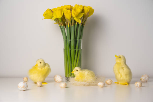 istock Spring greetings banner with chickens,eggs and flowers. Happy easter concept 1948356218
