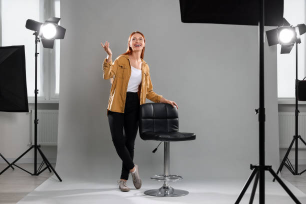 istock Casting call. Young woman performing on grey background 1948360417