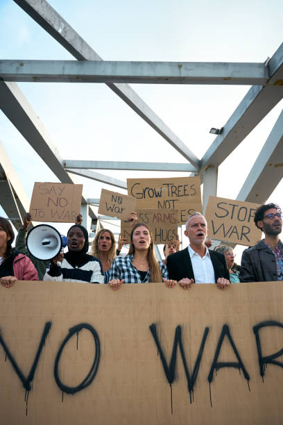 istock Multiracial diverse ages people protesting against war and violence in the world. Group of activists 1948363048