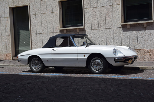 Atri, Italy - 3rd June, 2018: Alfa Romeo Spider Duetto parked on the street. This roadster produced from 1966 to 1993-with small run of 1994 models for the North American market.