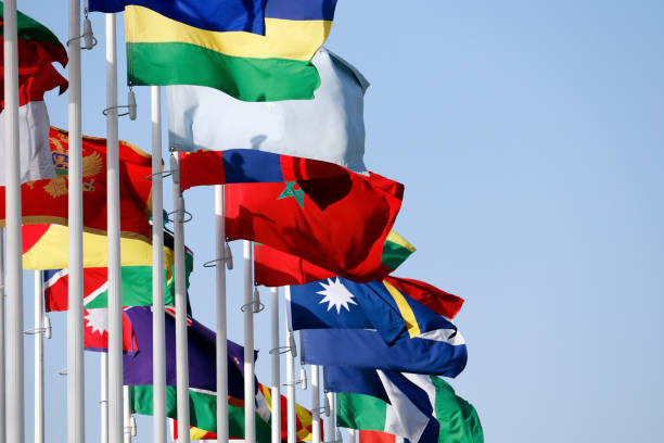 istock Group of flags of many different nations against blue sky during expo 1948412548