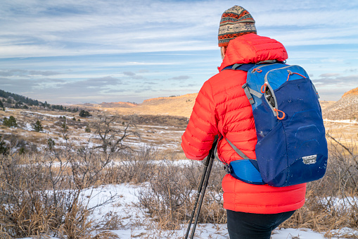 male backpacker in winter landscape of Colorado foothills - Horsetooth Mountain Open Space and Lory State Park