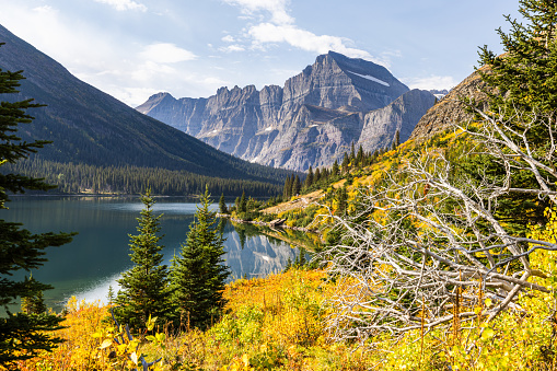 Hike to Grinnell Glacier in Montana during fall with Lake Josephine in the frame.