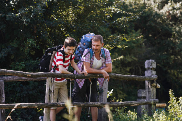 istock Father and son hiking together. 1948509186