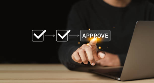 istock Businessman use laptop and touching approve document on virtual screen for business process workflow illustrating management approval and and project approve concept. 1948564104