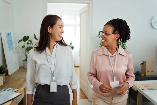istock Two female colleagues talking at the modern office 1948600338