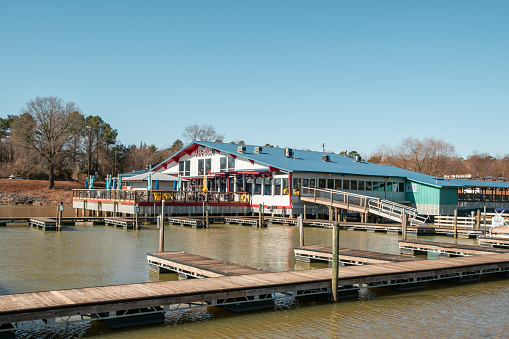 Lake Wylie, South Carolina, United States - 20 January 2024:  Back side of Papa Doc's in Lake Wylie, South Carolina with the boat docks in view on a sunny day.