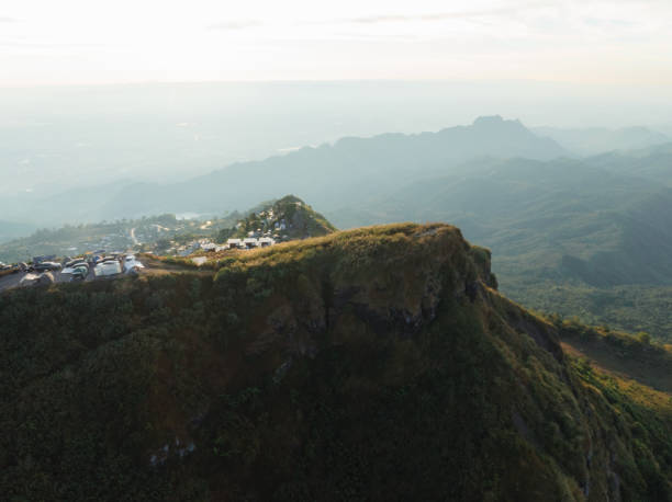 istock Sunset view at a mountain peak with an overlook parking area, providing visitors with a breathtaking panoramic view of the valley below 1948663871