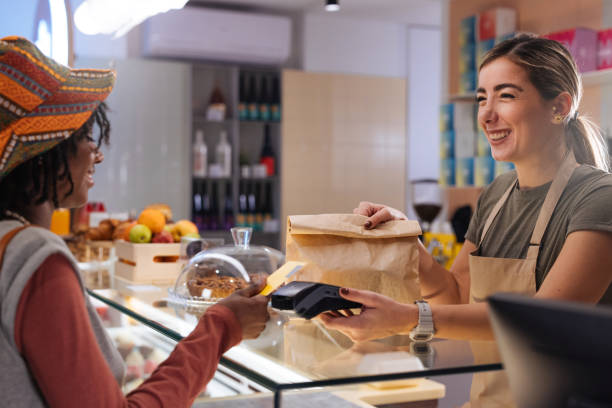 istock Taking out order at the restaurant and using contactless payment 1948666484
