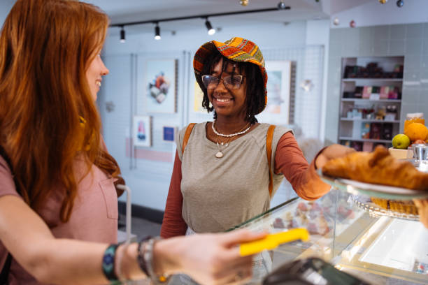 istock Two friends at the store counter 1948667566