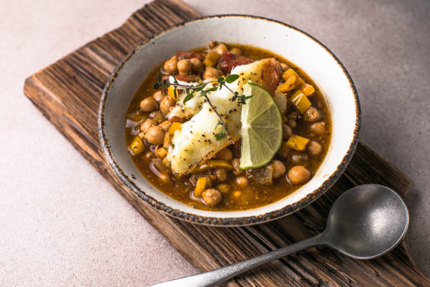 istock Potaje de vigilia - Chickpea stew with spinach and cod. Typical spanish food for Easter holidays. Chickpea stew with spinach 1948751098