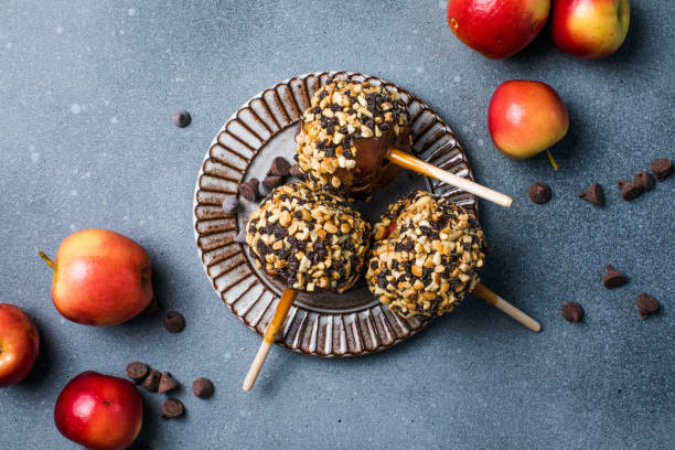 istock delicious carmel candy apples with covered in chopped nuts 1948770257