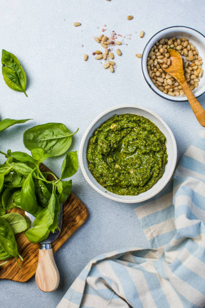 istock Pesto sause and ingredients on white background, copy space 1948770263