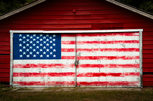 Flag of USA on dark concrete background.\nEmpty space provided for text placement for US celebrations such as: Memorial Day, Independence Day, etc.