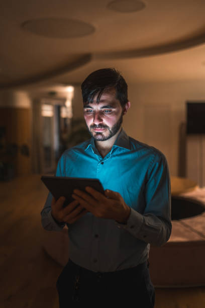 istock Young Caucasian Male Professional Working Late on Tablet 1948833963