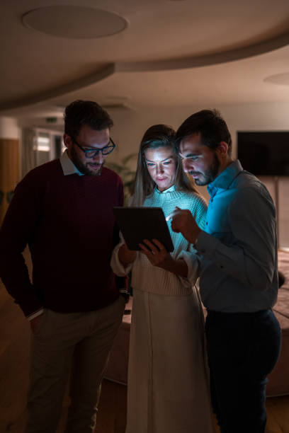 istock Diverse Business Team Working Late on Tablet 1948833972