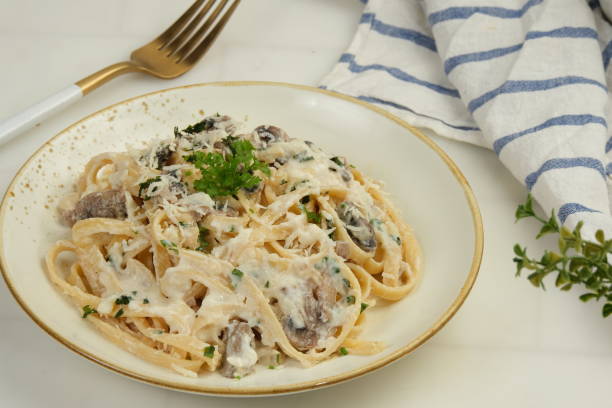 istock Fettuccine Pasta With Creamy Mushroom Sauce 1948871970