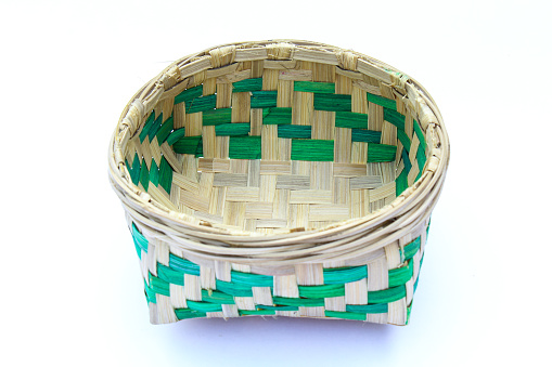 Bamboo basket on white background close-up view