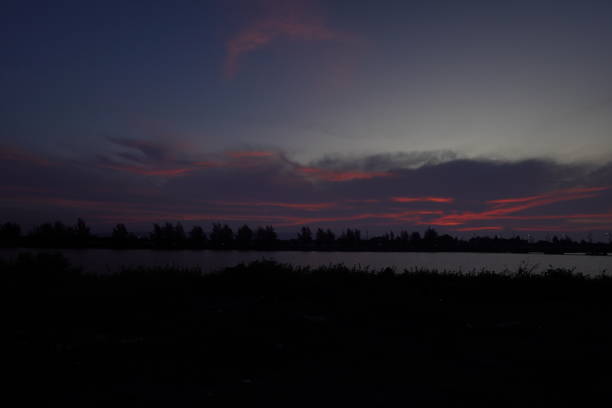 the sunlight on the clouds is reddish when the sun rises in the morning