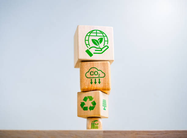 istock Earth care and environmental. Reduce CO2 emissions, carbon dioxide reduction, limit climate change, global warming concepts. Save the world, recycle icon, Net Zero symbols on wooden cube block stack. 1948938724