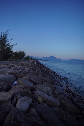 views of the sea, mountains from the embankment made of stone structures