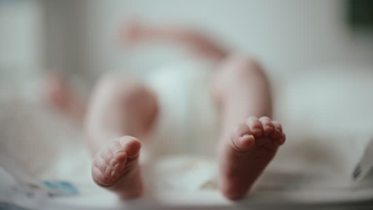 SLO MO Close-up Low Section of Baby Boy Lying on Bed at Home