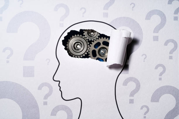 istock Thinking about problems and questions. Human head silhouette and gears. 1948997440