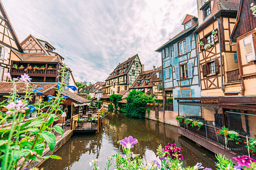 Colmar, Alsace, France. Petit Venice, water canal and traditional half timbered houses.